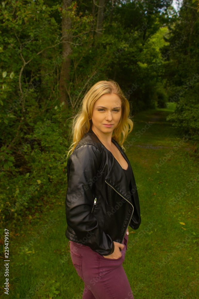 Fall woman in jacket in park