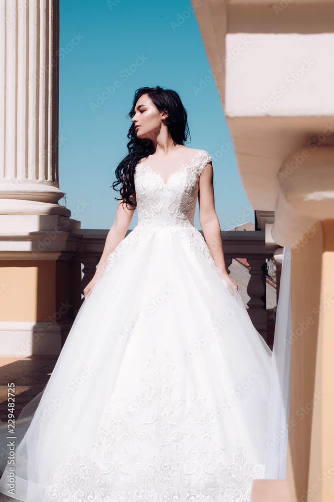 Beautiful wedding dresses in boutique. woman is preparing for wedding. Happy bride before wedding. Elegant wedding salon is waiting for bride. Wonderful bridal gown. Saying yes. Bride to be