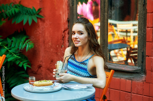 young girl in a fast food restaurant . the concept of fast food