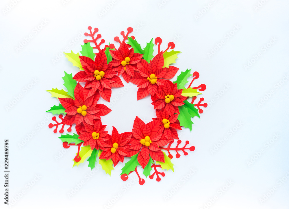 Paper flower poinsettia and leaves of holly Paper flower poinsettia and leaves of holly