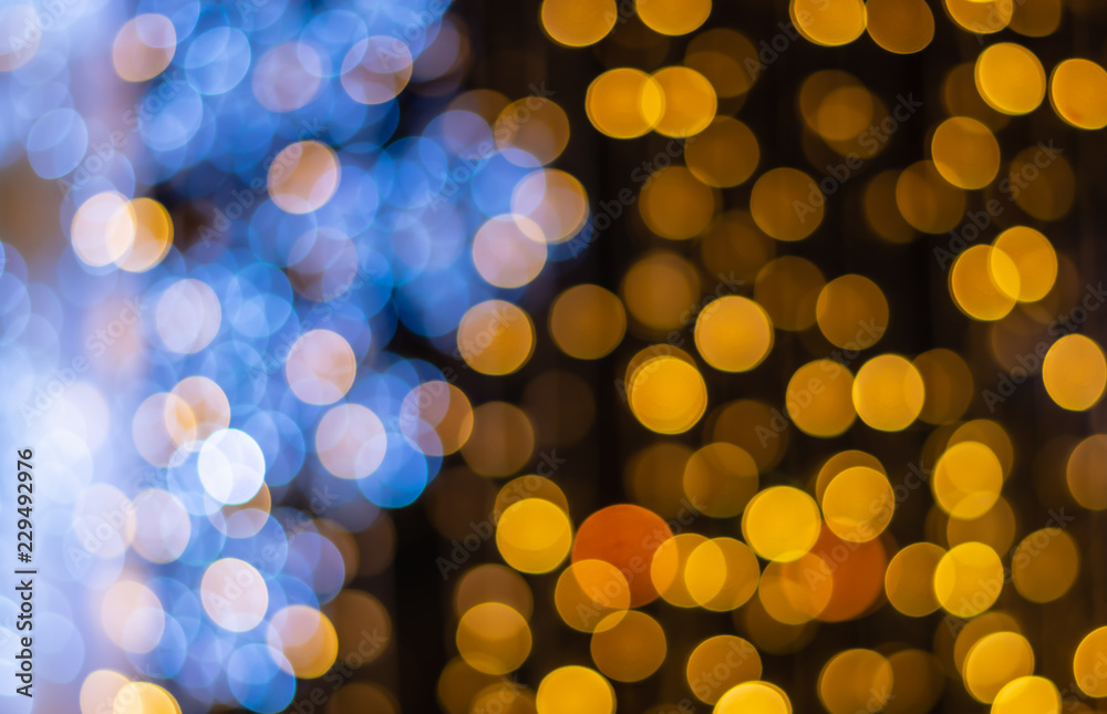 Abstract yellow blue light bokeh background for Christmas, Birthday, anniversary refocused blurred background. Abstract yellow blue light bokeh background for Christmas, Birthday, anniversary refocused blurred background.