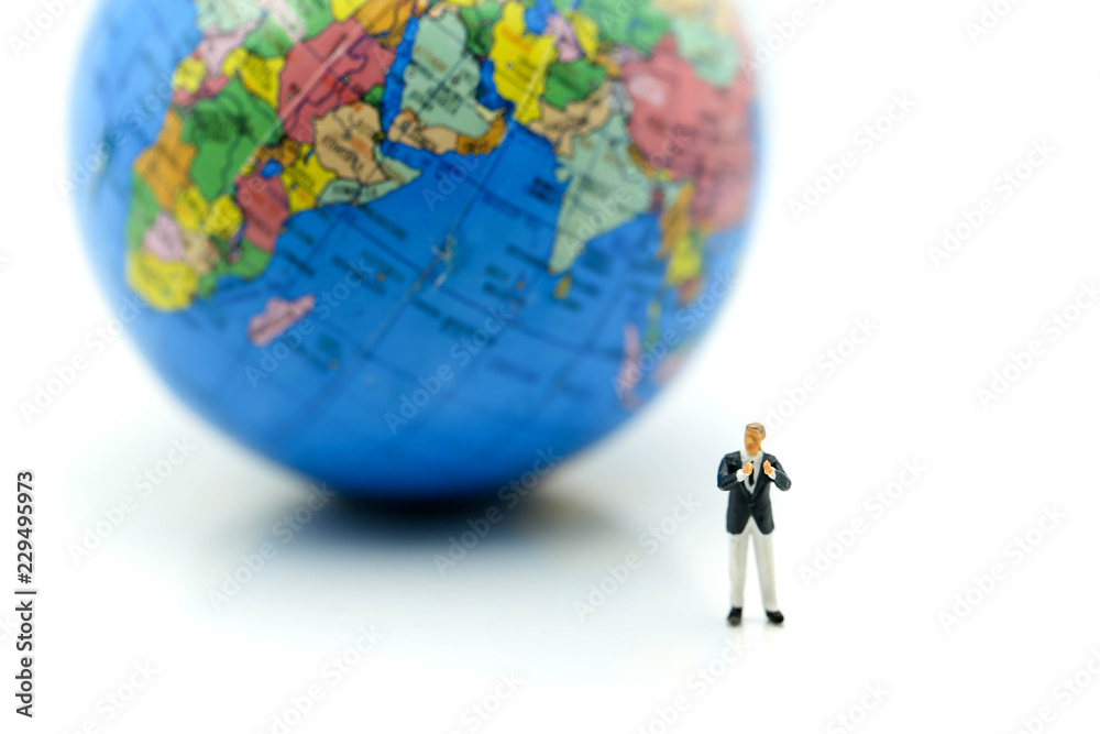 Miniature people : Businessman with mini world using for concept of International Men's Day. Miniature people : Businessman with mini world using for concept of International Men's Day.