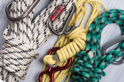 set of ropes with a carabiner for a rock climber, closeup background