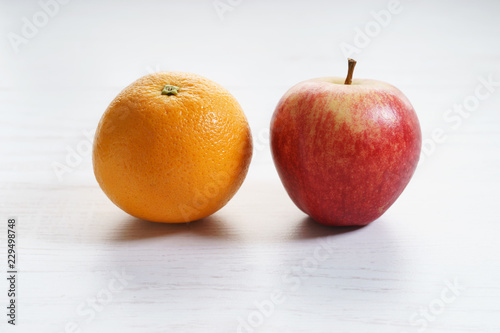 fresh red apple and orange