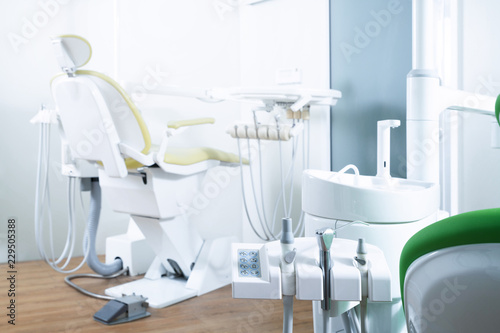 Modern dental practice. Dental chair and other accessories used by dentists © Songkhla Studio