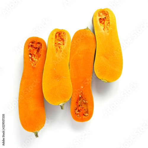 Long orange pumpkin in a cut, isolated on a white background, top view.