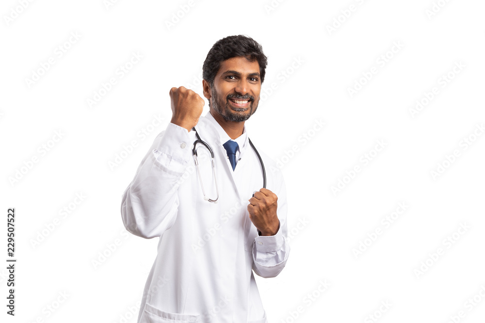 Doctor making celebrating gesture with hands as fists . Doctor making celebrating gesture with hands as fists .