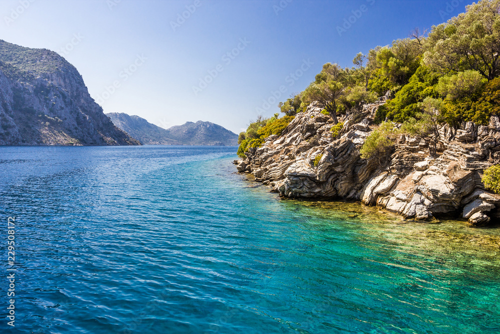 Rocky coast of the island in the Aegean sea Rocky coast of the island in the Aegean sea