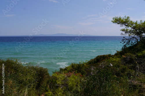 a beautiful beach with blue waters © Kolovic