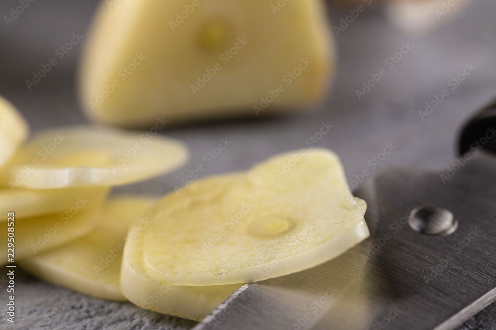 Garlic heads close-up on grey background. Condiment. Garlic heads close-up on grey background. Condiment.