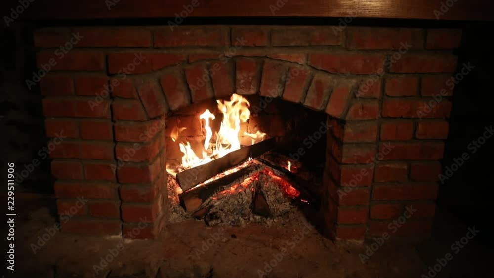 Autumn or winter burning fireplace cozy evening concept close up. Close up shot of burning firewood in the fireplace. Selective focus Autumn or winter burning fireplace cozy evening concept close up. Close up shot of burning firewood in the fireplace. Selective focus