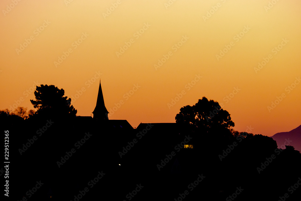 Obraz premium Church silhouette at sunset