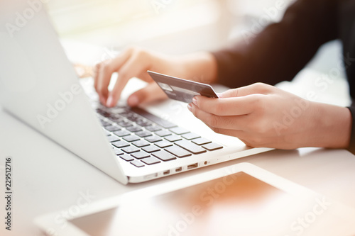 shopping and online payment by using laptop computer and tablet with credit card photo