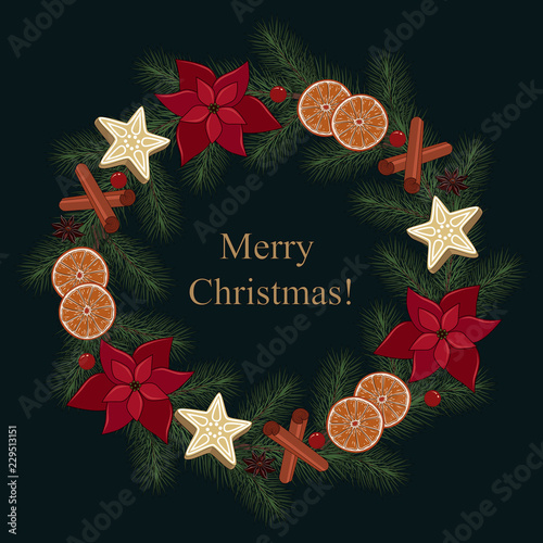 Christmas wreath of fir branches with oranges, cinnamon, flowers, on a dark blue background.