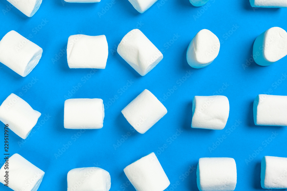 Marshmallows on blue background Marshmallows on blue background