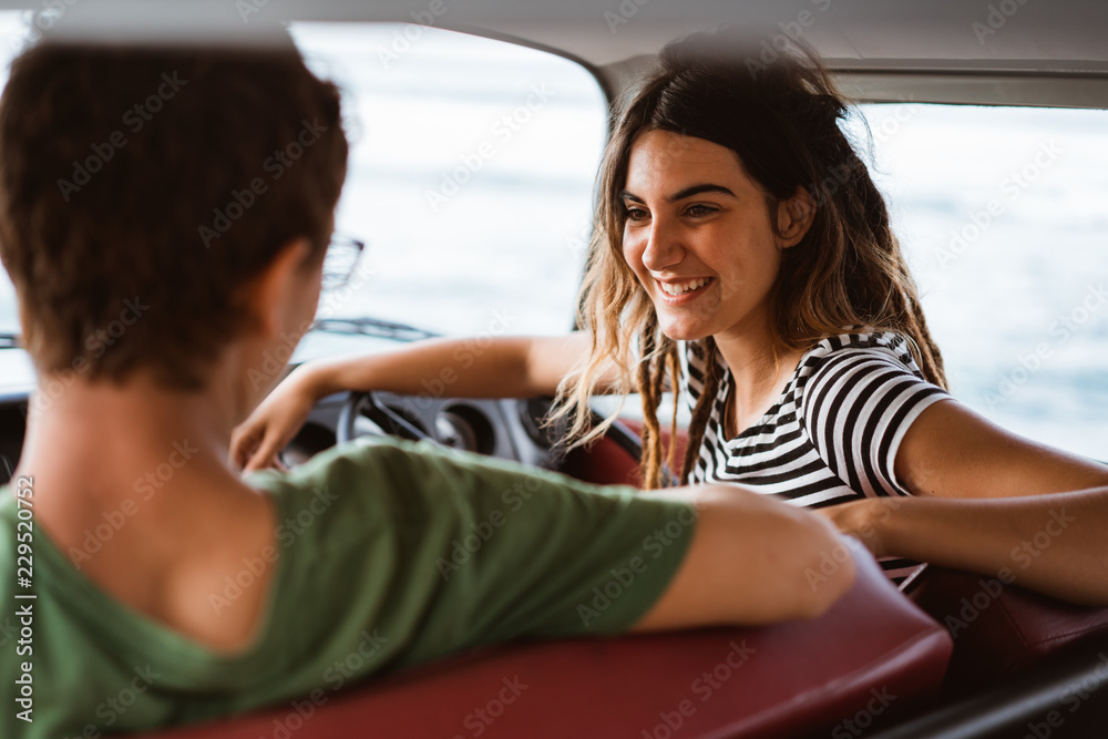beautiful young couple sitting in their car beautiful young couple sitting in their car