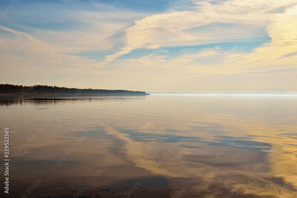 Panoramic dramatic sunset sky. Clouds reflected in the Dnieper River near the Kyiv city, Ukraine. Concept of landscape and nature