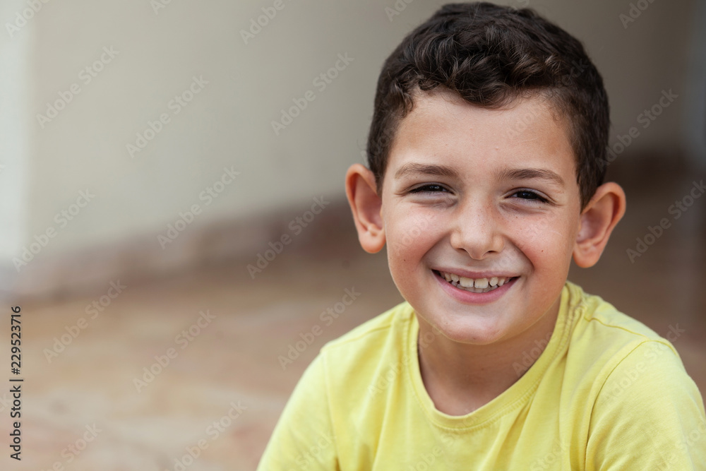 Portrait of happy smiling child boy outdoors. Concept of happy family or successful adoption or parenting. Portrait of happy smiling child boy outdoors. Concept of happy family or successful adoption or parenting.
