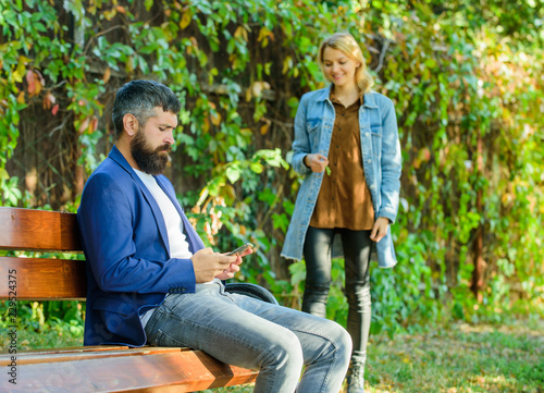Couple in love romantic date walk nature park background. Man bearded hipster wait girlfriend. Park best place for romantic walk. Great date tips. Love relations romantic feelings. Romantic concept © be free