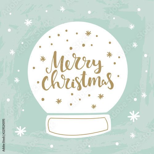 Merry Christmas hand lettering in snow ball illustration. Modern calligraphy greeting card
