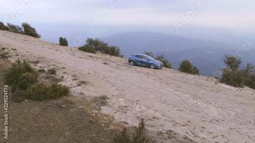 Aerial view of off-road car on mountain road