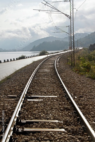 Railroad tracks, hills, and a lake - gorgeous landscape in Montenegro