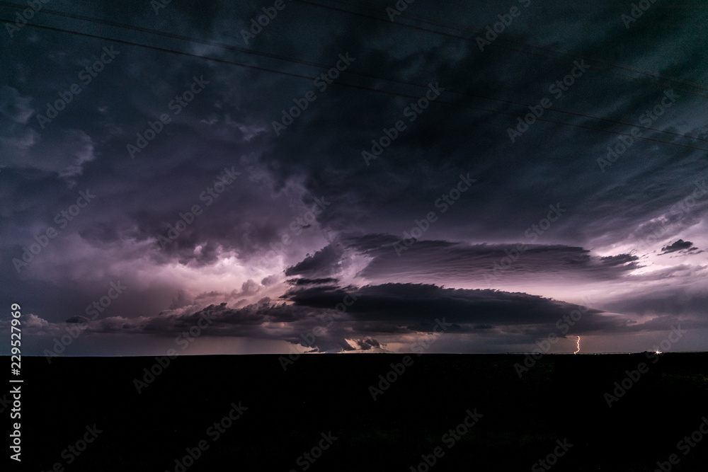 A supercell thunderstorm produces lightningbolts over the Great Plains A supercell thunderstorm produces lightningbolts over the Great Plains