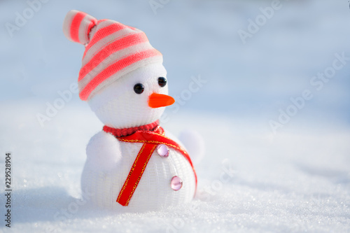 Snowman in the snow. Winter time scene. © Miramiska