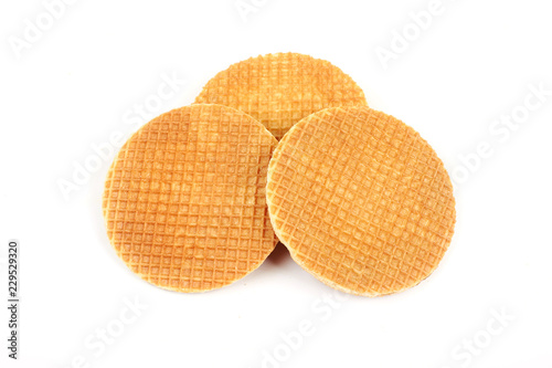 Dutch waffle called a stroopwafel isolated on a white background.