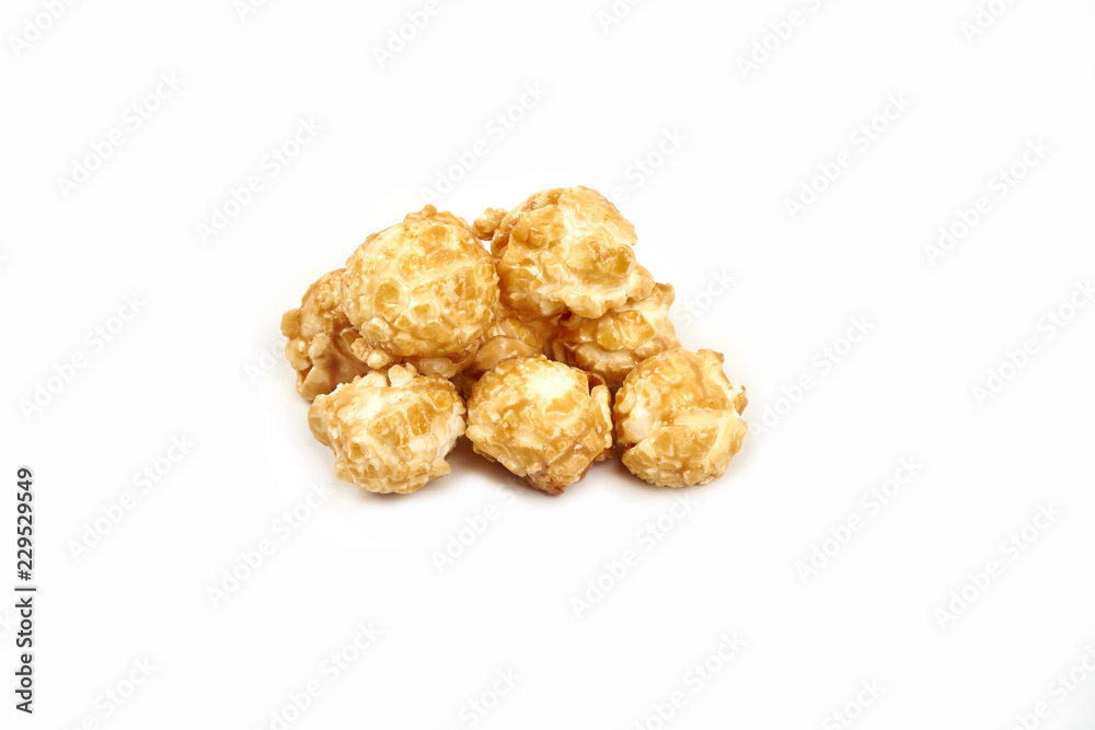 Pile of caramel popcorn on white background. Pile of caramel popcorn on white background.