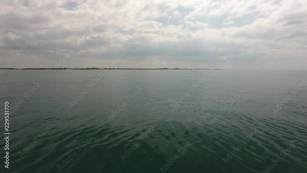Aerial drone shot flying over mediterranean sea in South of France. low altitude flight towards the shore. Aerial drone shot flying over mediterranean sea in South of France. low altitude flight towards the shore.