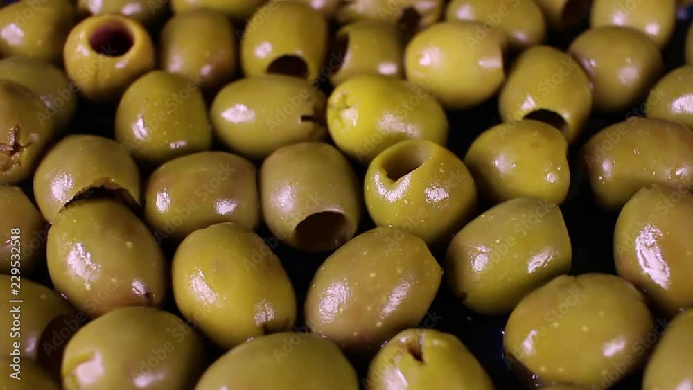 Olive texture. Olives as background. Shiny green olives. Olive wallpaper pattern texture. Olive texture. Olives as background. Shiny green olives. Olive wallpaper pattern texture.