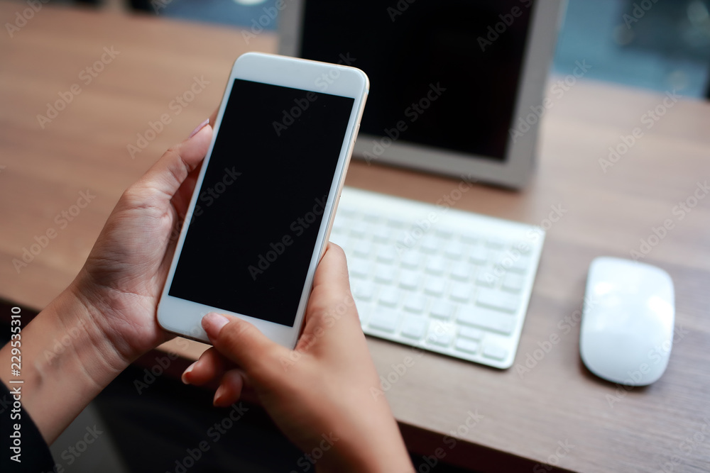 businesswoman hands using table and cell phone