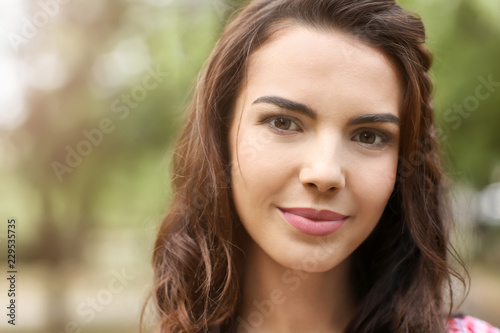 Portrait of beautiful young woman outdoors