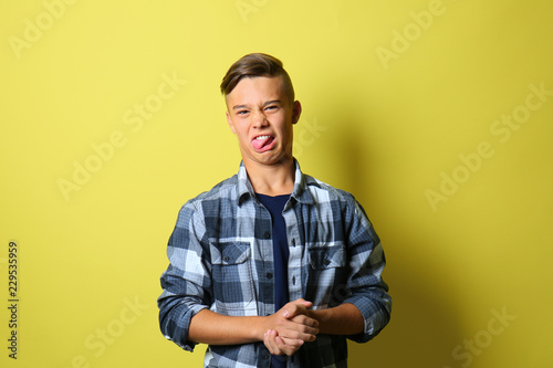 Disgusted teenage boy on co...