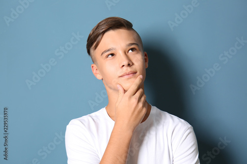 Thoughtful teenage boy on c...