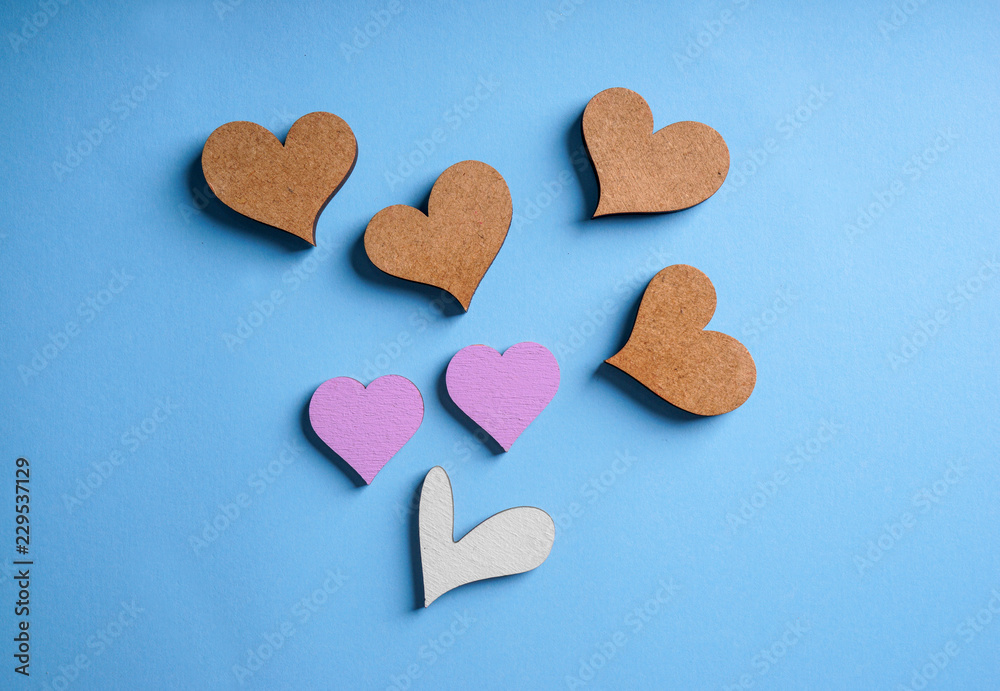 Different hearts on color background