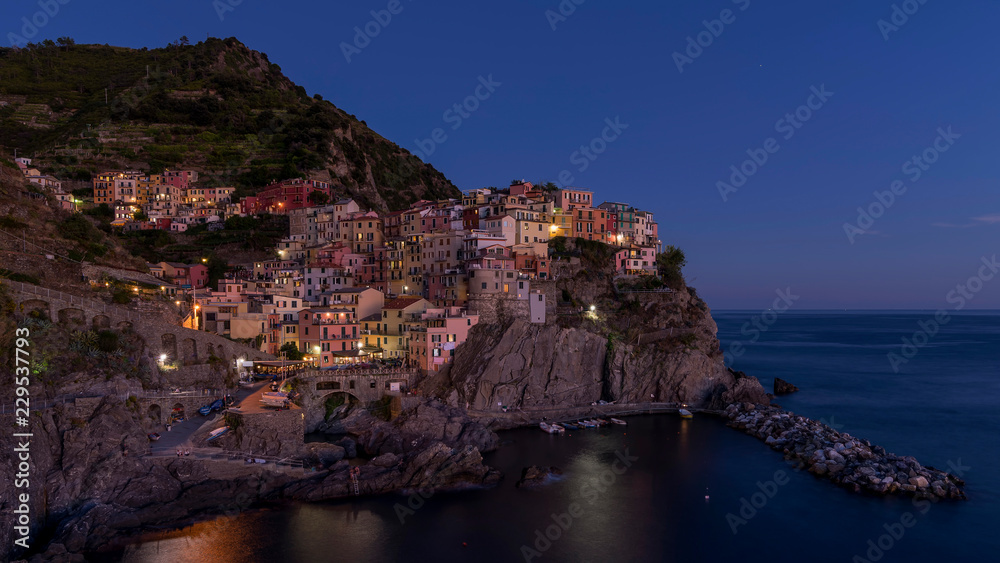 Beautiful view of the seaside village of Manarola in the the blue hour light, Cinque Terre, Liguria, Italy