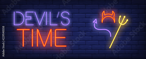 Devil time neon text with horns, tail and trident. Halloween party invitation advertisement design. Night bright neon sign, colorful billboard, light banner. Vector illustration in neon style.