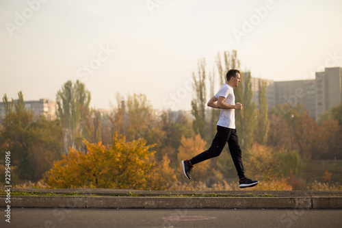 Man run at autumn morning. Healthy lifestyle