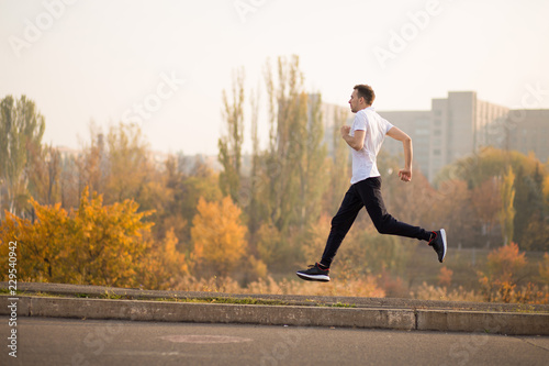 Man run at autumn morning. Healthy lifestyle