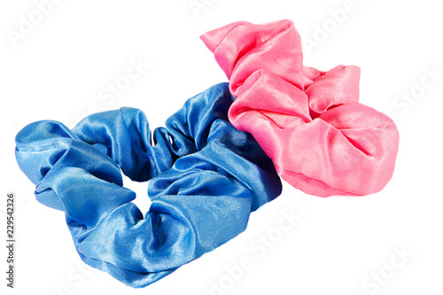 Pair of Hair scunchies, one pink and one blue, isolated on white.