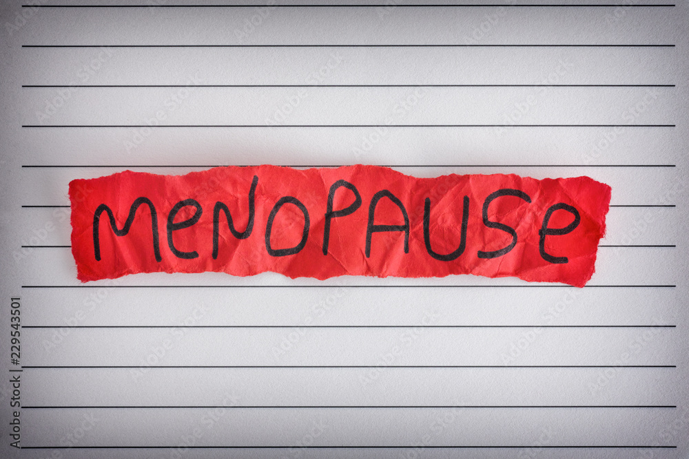 Piece of red paper with word Menopause