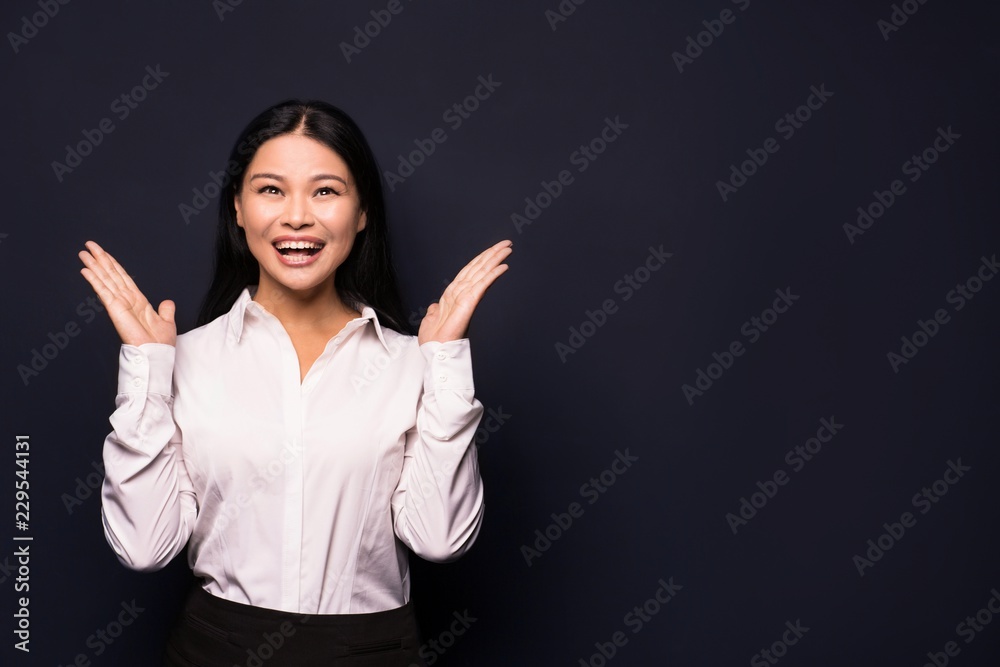 Fashion asian business woman with long dark hair posing on camera. Woman in business concept. Fashion asian business woman with long dark hair posing on camera. Woman in business concept.
