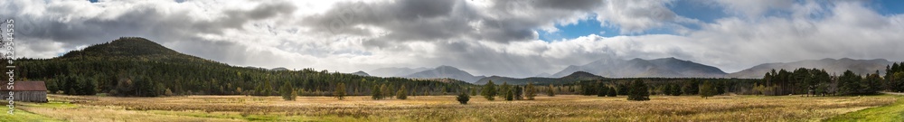 Panoramic view of a late fall mountains scene with spectacular sky near Lake Placid NY