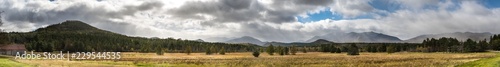 Panoramic view of a late fall mountains scene with spectacular sky near Lake Placid NY