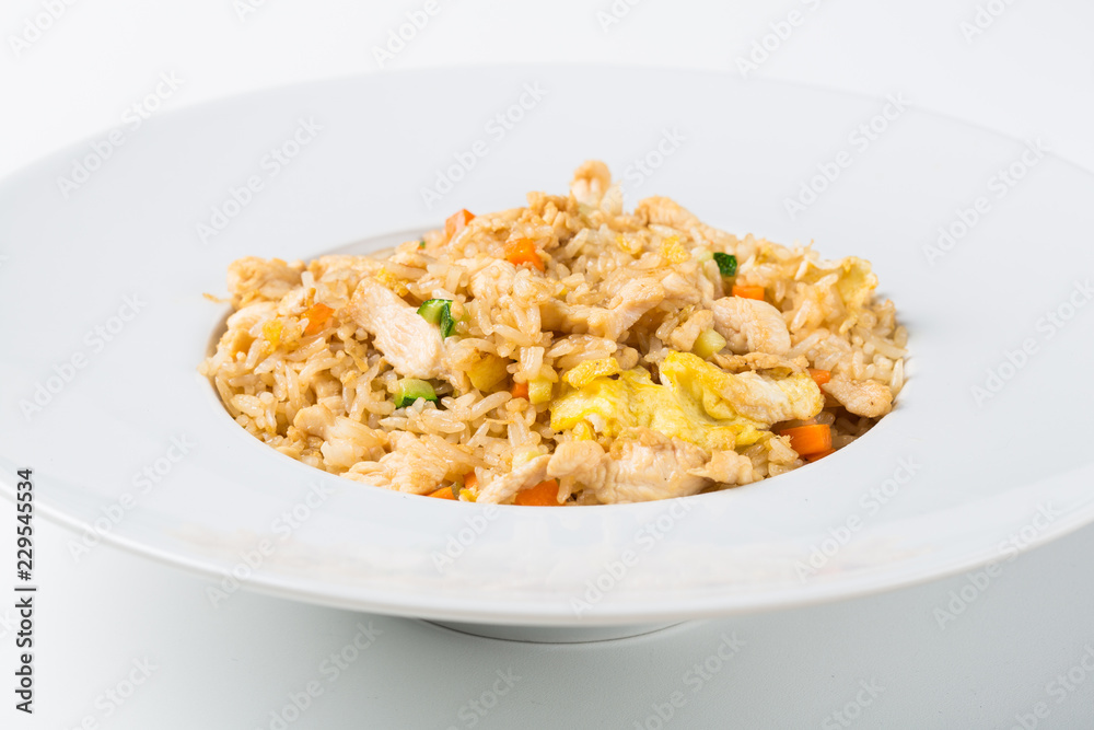 Grilled rice with chicken and egg vegetables in a white dish