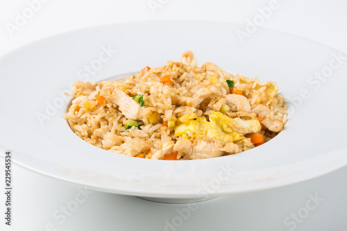 Grilled rice with chicken and egg vegetables in a white dish