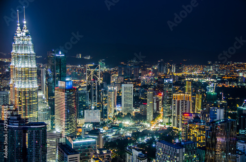 Famous Petronas Twin Towers skyscrapers Kuala Lumpur, Malaysia. Aerial skyline view at night