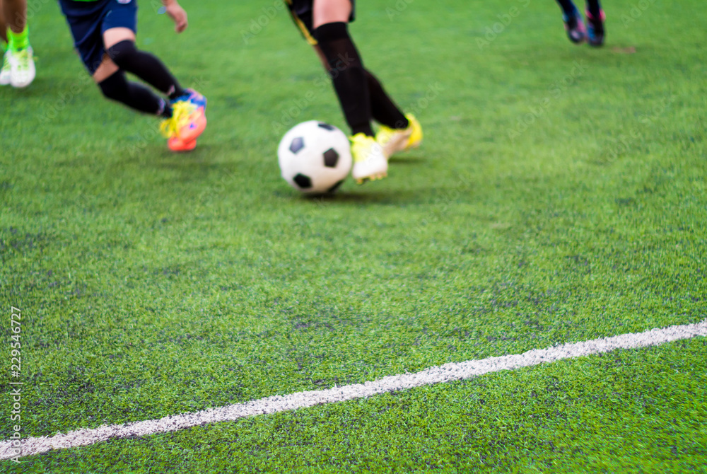 The footballers are competing in sports day of elementary school